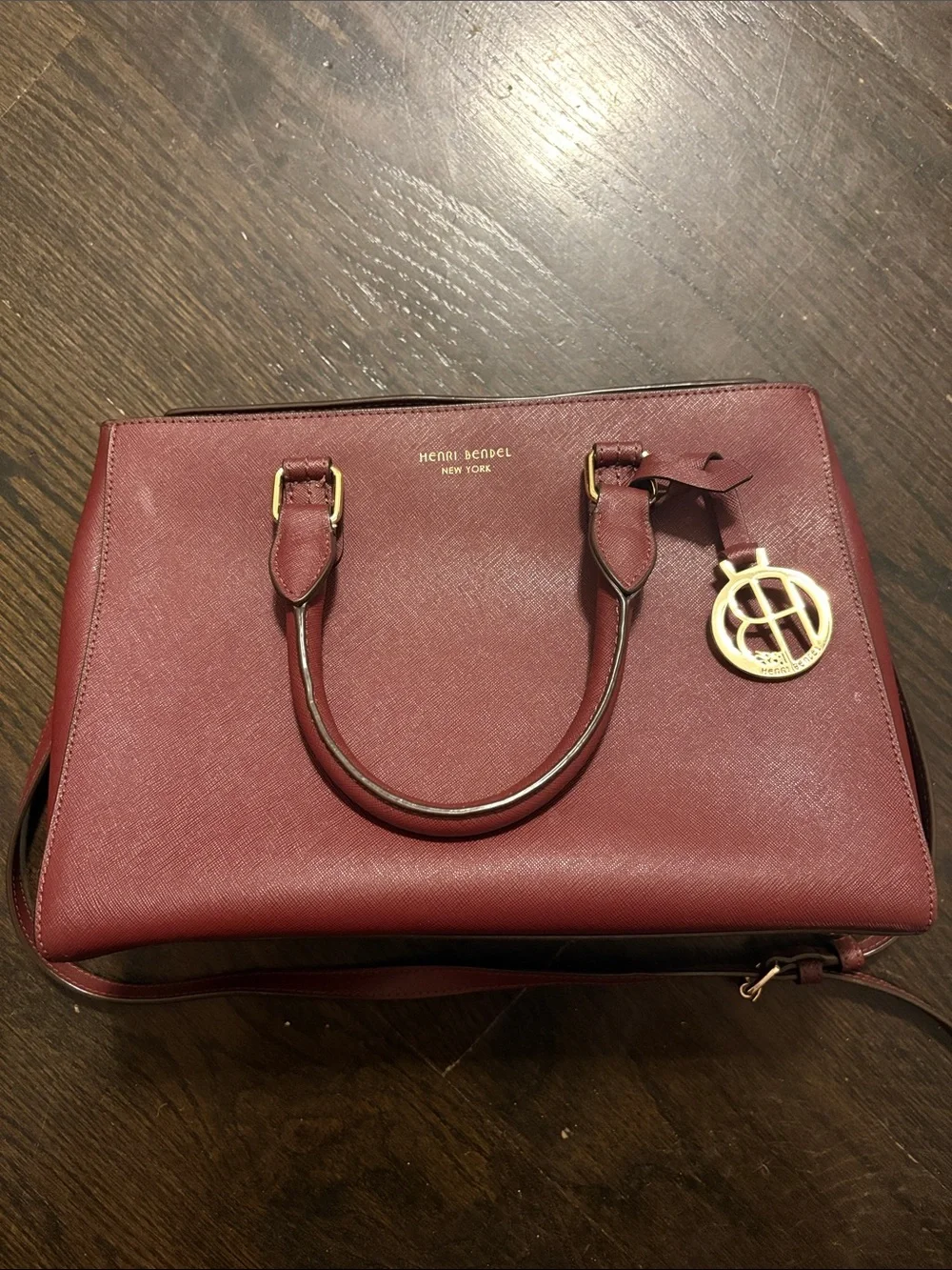 henri bendel wine red saffiano leather satchel with gold-tone charm